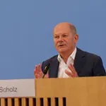 Nemški kancler Olaf Scholz proti protekcionizmu in trgovinskim vojnam