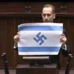 Πολωνία: Βουλευτής ύψωσε ισραηλινή σημαία με σβάστικα μέσα στο κοινοβούλιο (Βίντεο)
